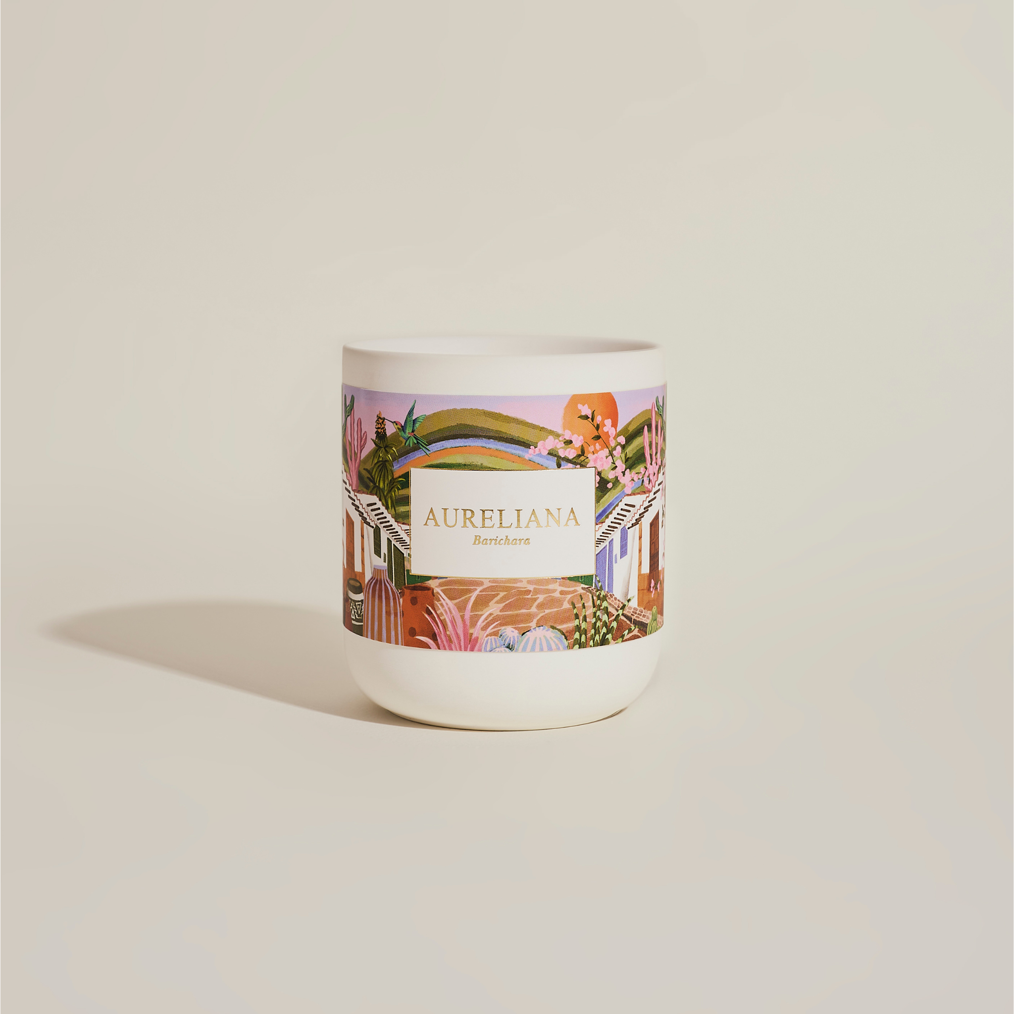 Candle with decorative label on a beige background