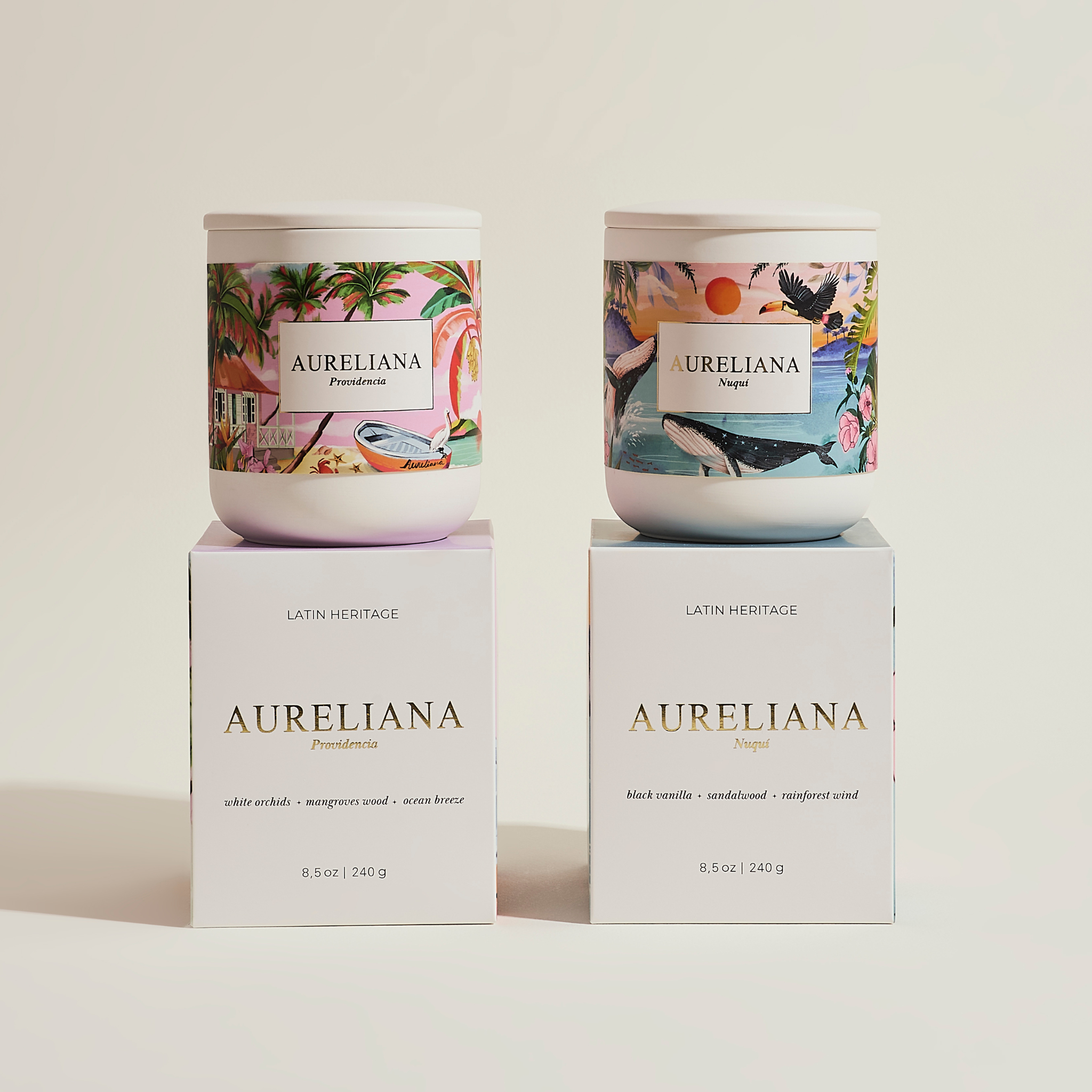 Two Aureliana candles on their boxes against a light background